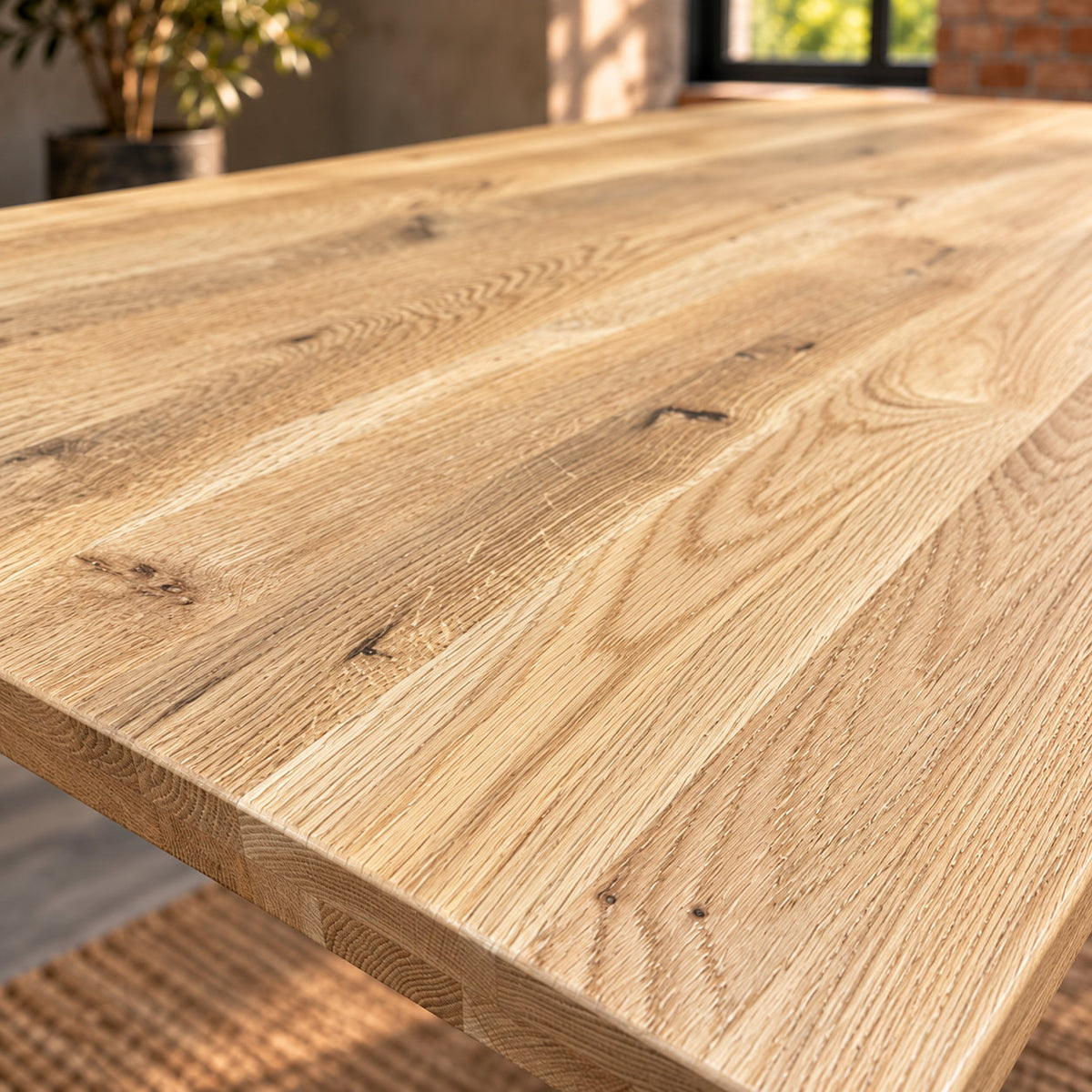 Close-up of the Fusion compact dining table’s sandblasted oak top, showing textured grain and natural knots.