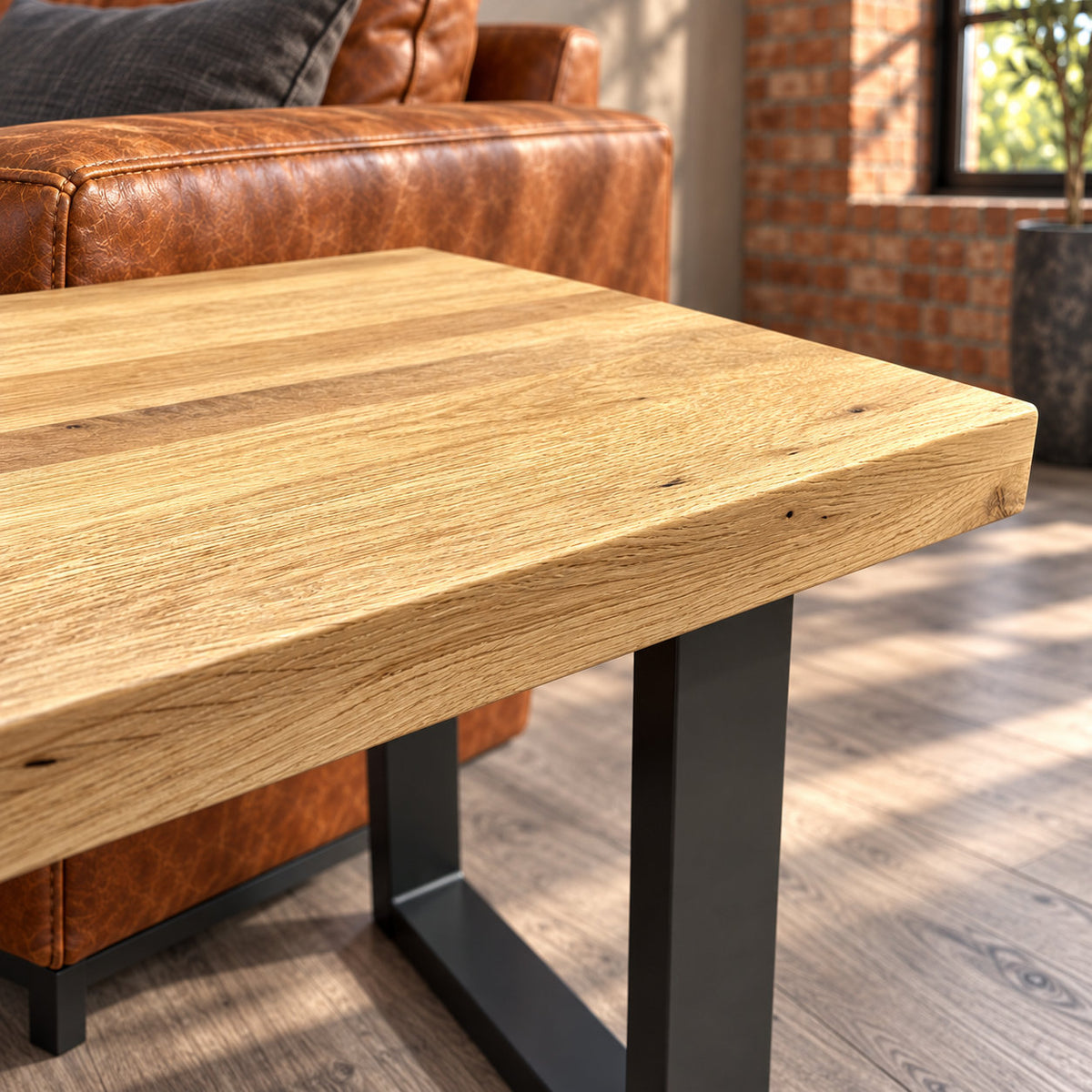 Detail of the Fusion oak lamp table's straight top edge, textured surface and charcoal steel support.