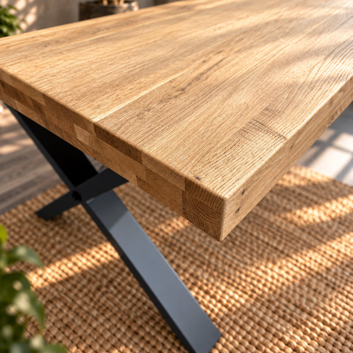 Downward view of a Fusion oak dining table corner, showing the textured surface and oak end grain along the edge.