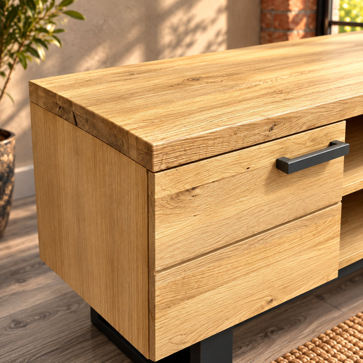 Detail of the Fusion oak TV unit's straight oak top edge and corner above the cupboard door.