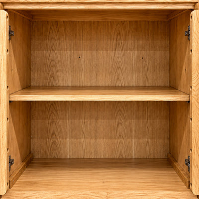 Interior detail of the Fusion Oak 2 Door Sideboard showing its full-width shelf, oak lining and open door backs.
