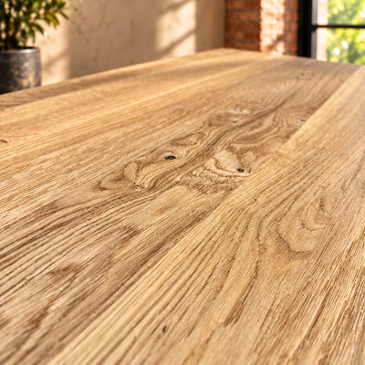 Close-up of the natural grain and knots in the Fusion Oak sideboard’s oak top.
