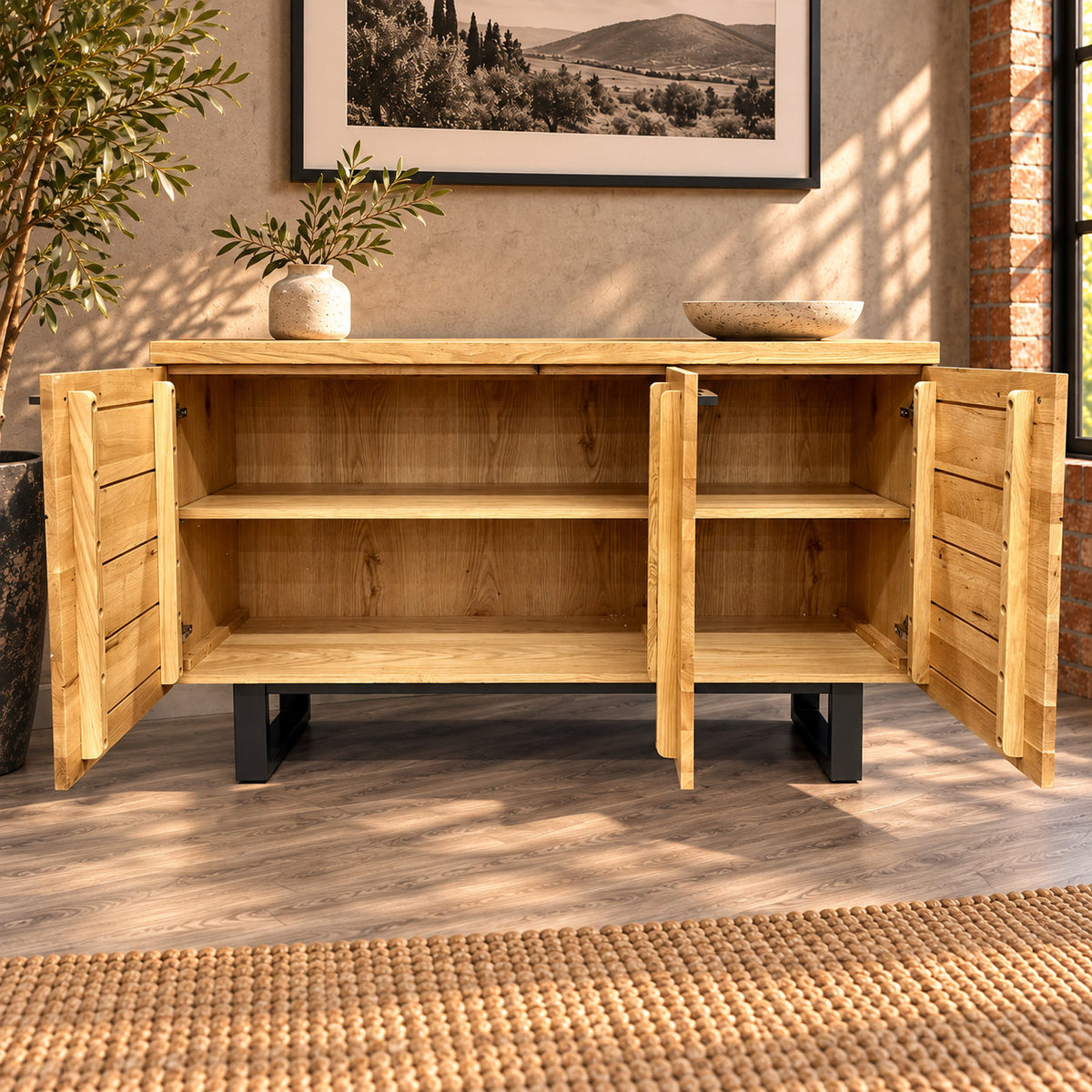 Fusion oak sideboard with all three doors open, showing a wide cupboard and a narrow cupboard, each with one shelf.