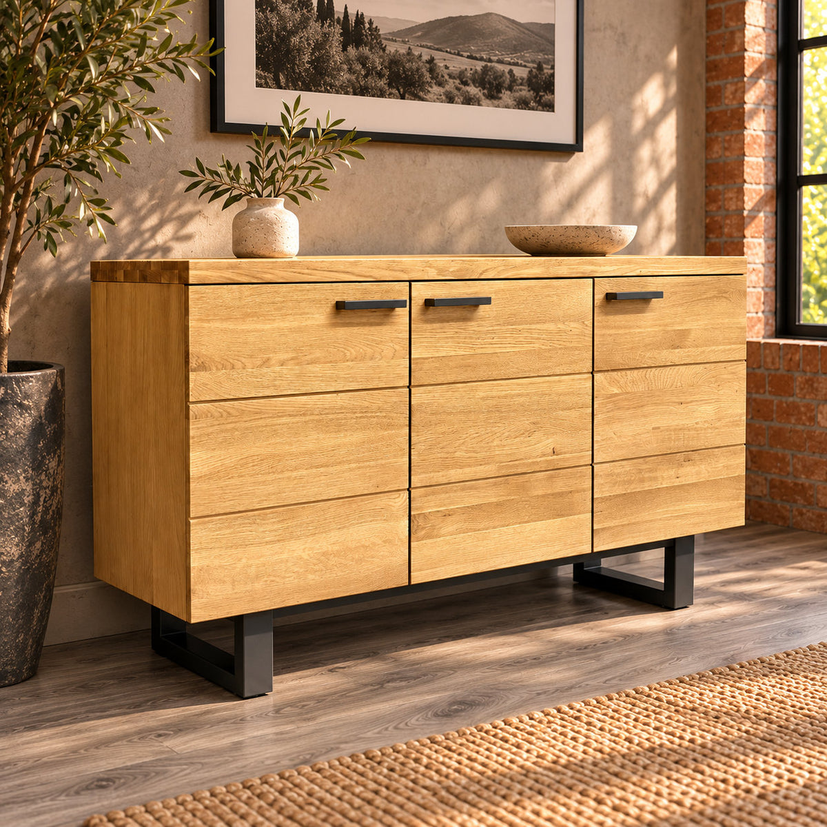 Fusion oak three-door sideboard with black metal handles and loop legs in a warm industrial room.