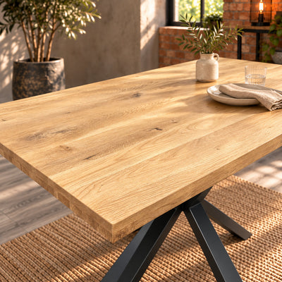 Sandblasted oak surface of the Fusion compact dining table styled with a cream plate, linen napkin, glass and vase.
