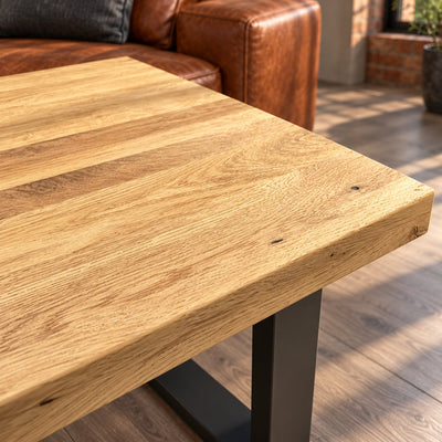 Close-up of the Fusion lamp table's sandblasted oak surface, showing subtle raised grain and shallow recesses.
