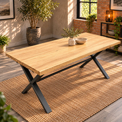 Elevated view of the Fusion oak large dining table showing its long rectangular oak top and dark metal cross legs.
