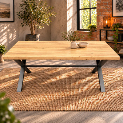 Long-side view of the Fusion oak large dining table showing the oak tabletop, charcoal legs and connecting rail.