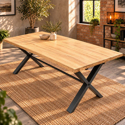 Fusion oak large dining table viewed from the opposite corner in a room with exposed brick and a natural rug.
