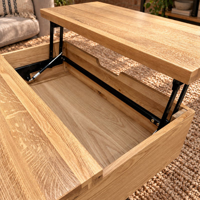 Elevated view of the Fusion oak coffee table with its tray raised, showing the storage well and two rear cubbies. Product Code: FSLSCT from https://www.oakoutlet.co.uk/collections/fusion-oak-dining-furniture/products/fusion-oak-laptop-storage-coffee-table