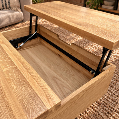 Elevated view of the Fusion oak coffee table with its tray raised, showing the storage well and two rear cubbies. Product Code: FSLSCT from https://www.oakoutlet.co.uk/collections/fusion-oak-dining-furniture/products/fusion-oak-laptop-storage-coffee-table