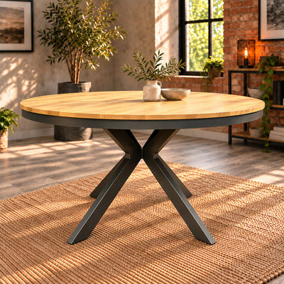 Front view of the Fusion round dining table showing the slim oak top, dark metal rim and crossed central legs.
