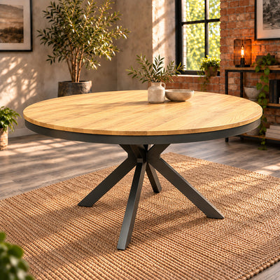Angled view of the Fusion round oak dining table and its four-foot charcoal metal base.
