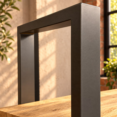 Detail of the Fusion shelf unit's charcoal rectangular metal frame above the top shelf.
