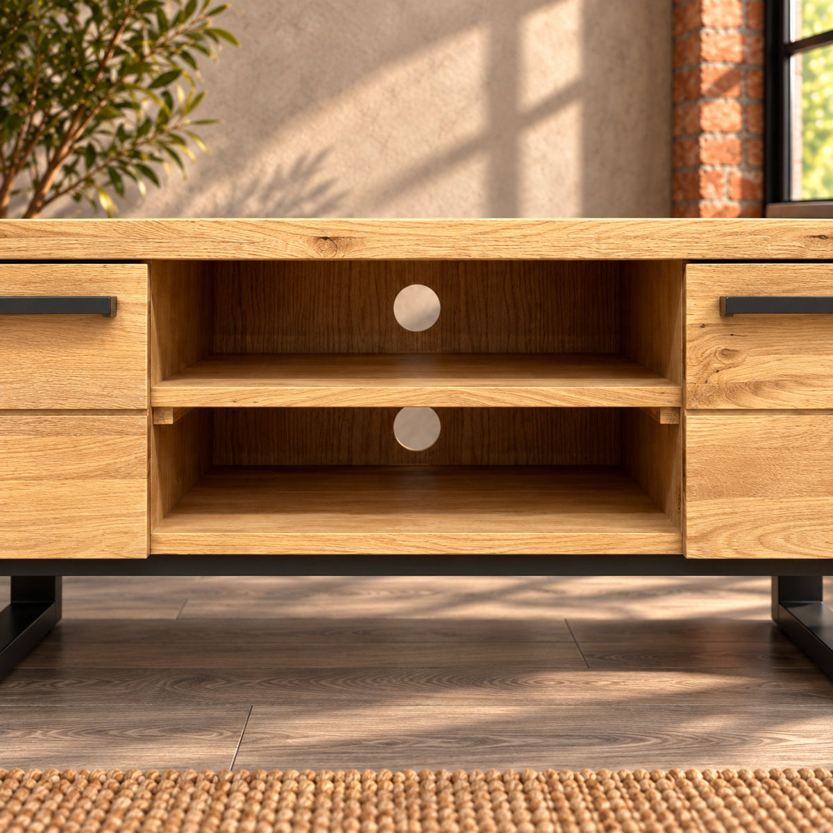 Two open central compartments in the Fusion oak TV unit, with a single oak shelf and circular cable access holes.
